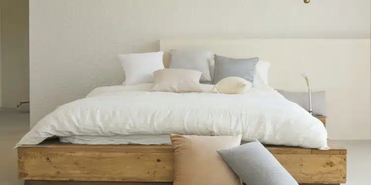 white bed pillow on brown wooden bed frame